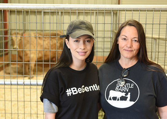 Christian Serratos and Founder of The Gentle Barn Foundation Ellie Laks greet a cow and her calf rescued from slaughterhouse at The Gentle Barn 