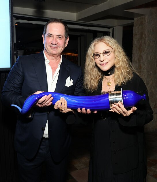 10th Anniversary Genesis Prize Laureate Barbra Streisand receives a glass sculpture of a shofar