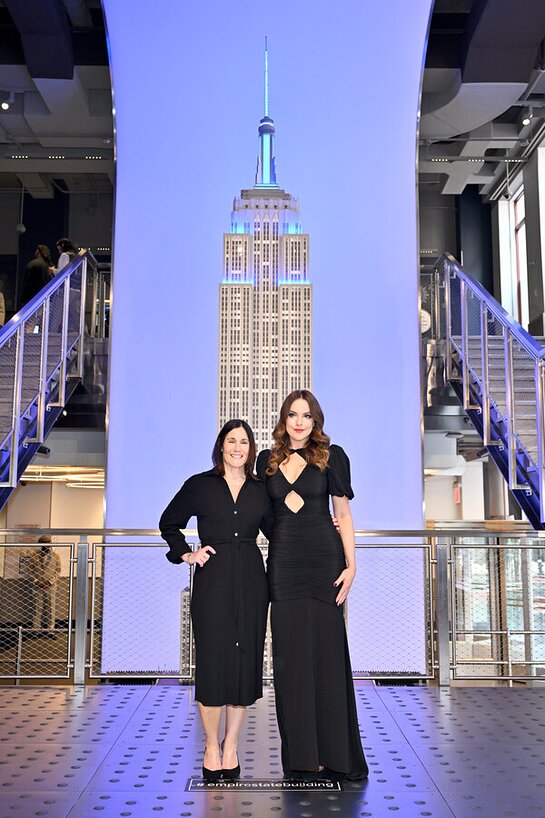 Smile Train CEO Susannah Schaefer and Elizabeth Gillies visit the Empire State Building in Honor of World Smile Day